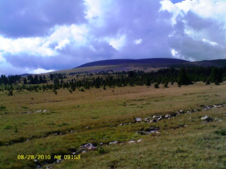 Grassing slope toward Mount Tokewanna. Summit hidden behind clouds and knoll.